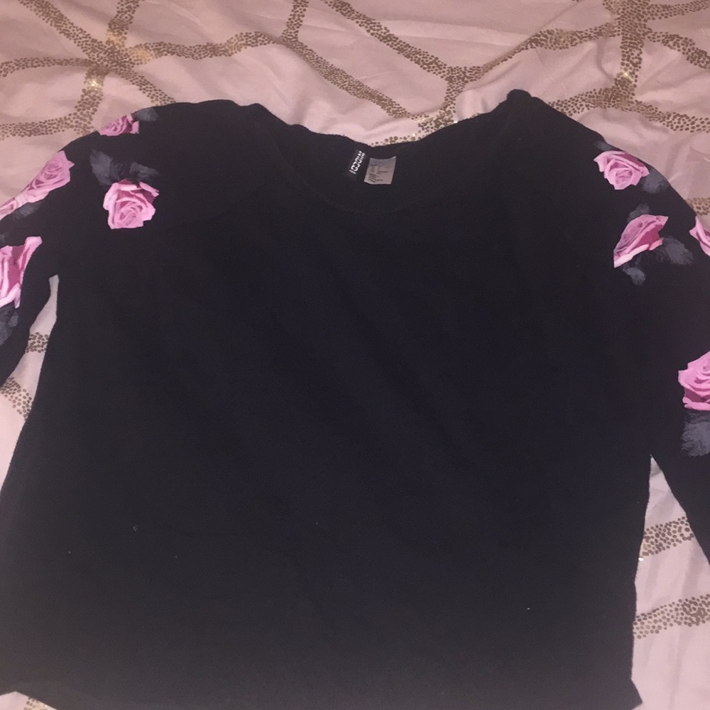 Black and pink floral sleeve sweater.